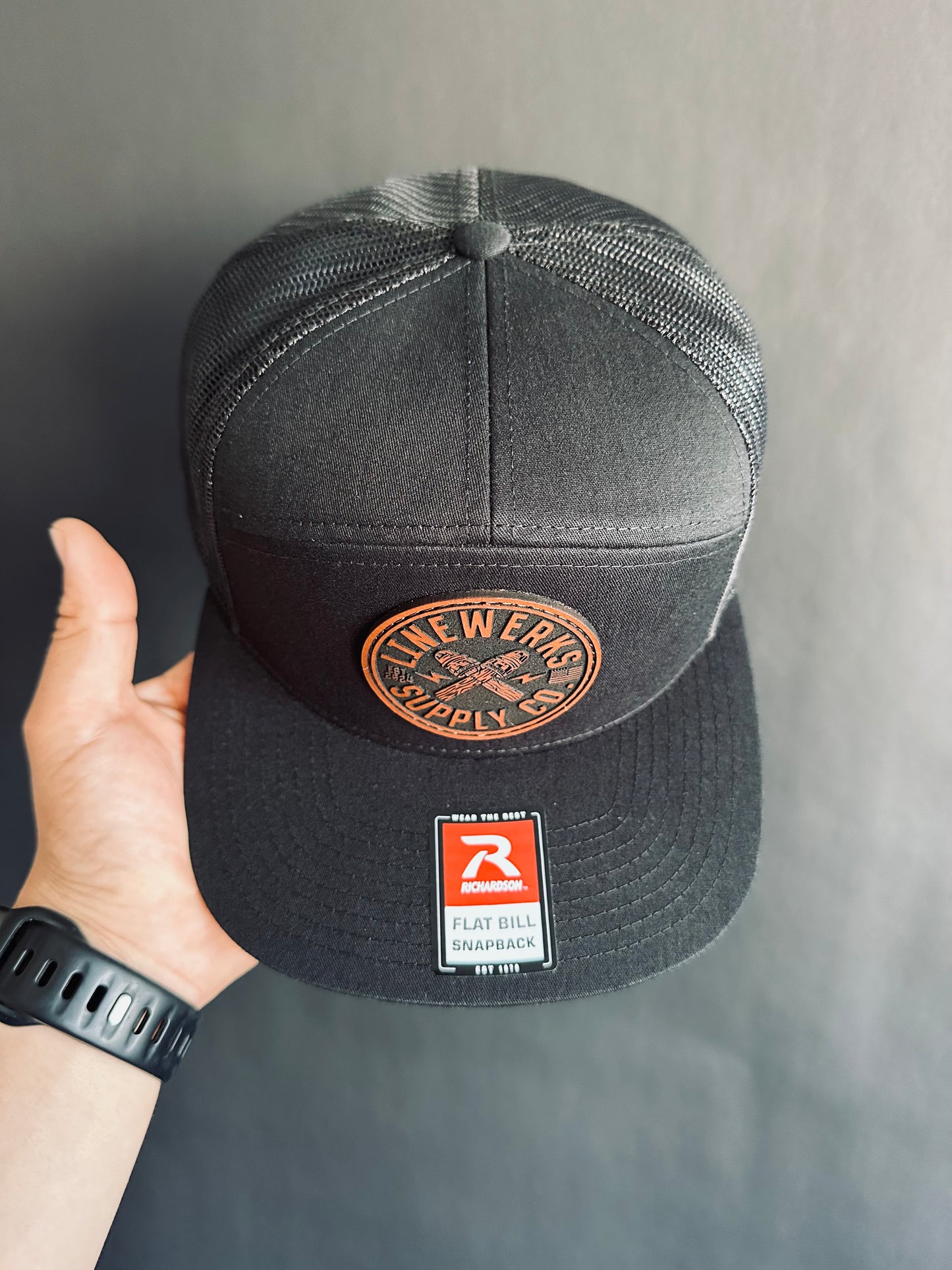 168-LP Richardson Seven-Panel Trucker Cap with Brown Leather Patch