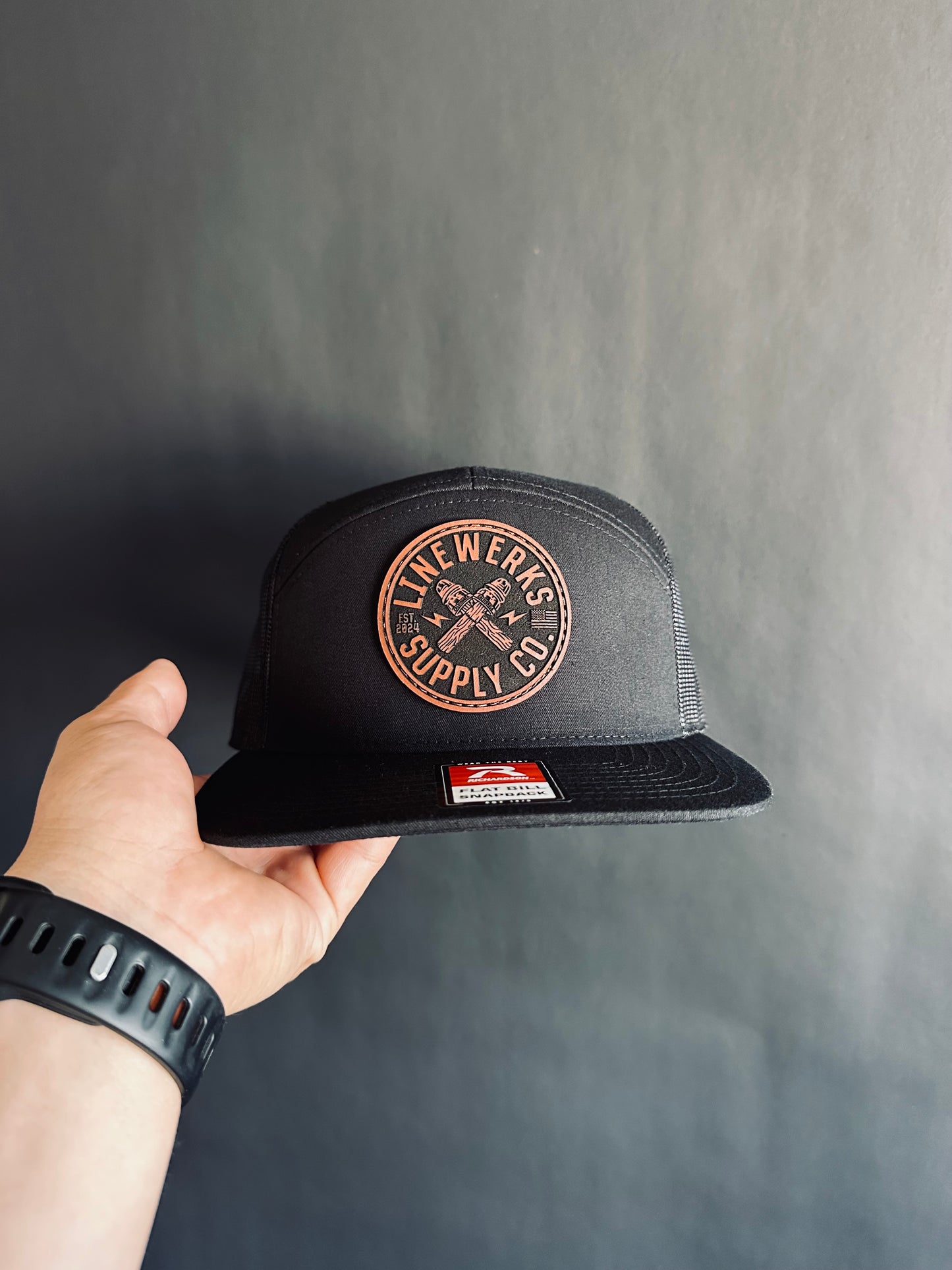 168-LP Richardson Seven-Panel Trucker Cap with Brown Leather Patch